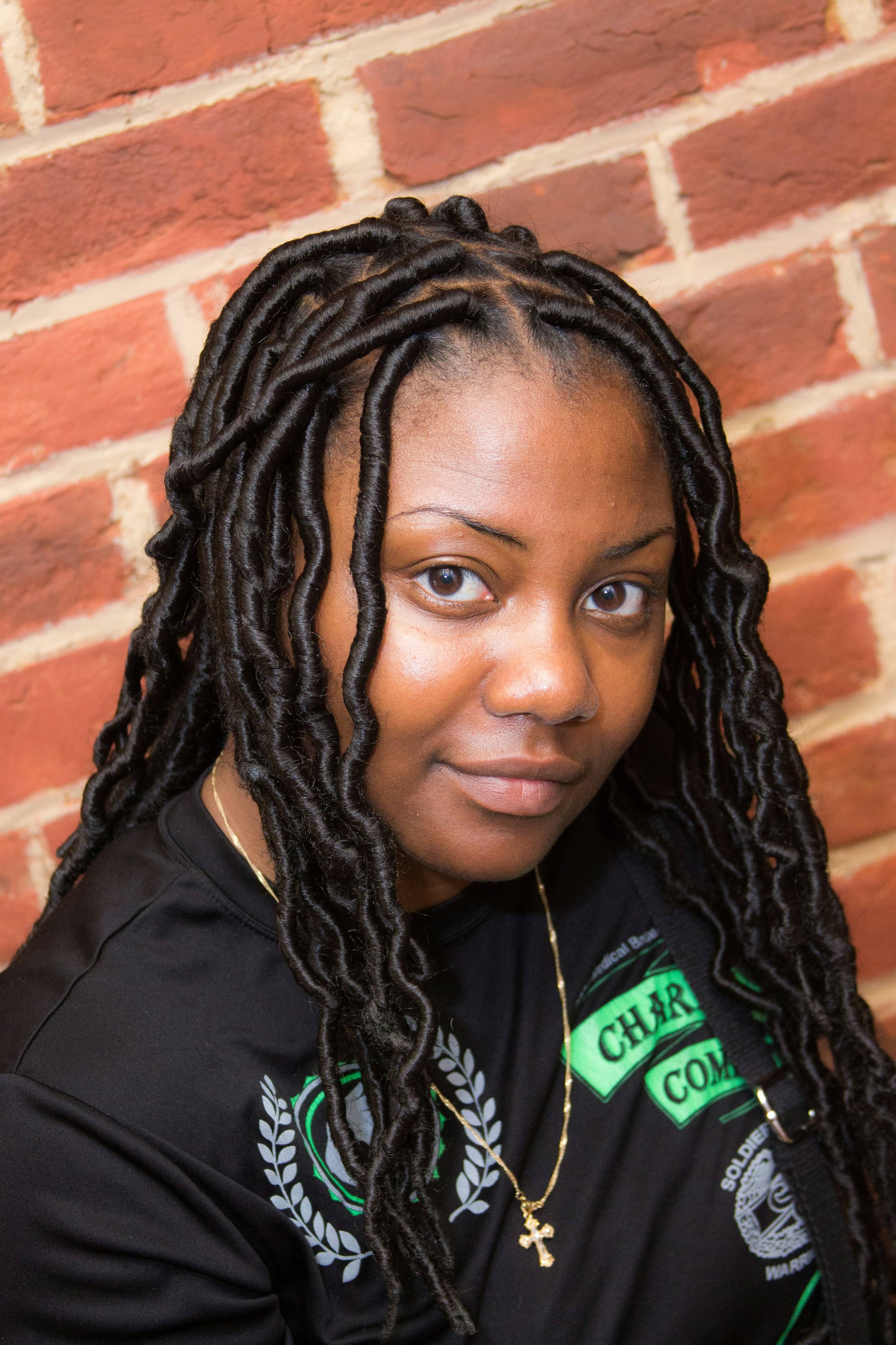 Woman with long faux locs