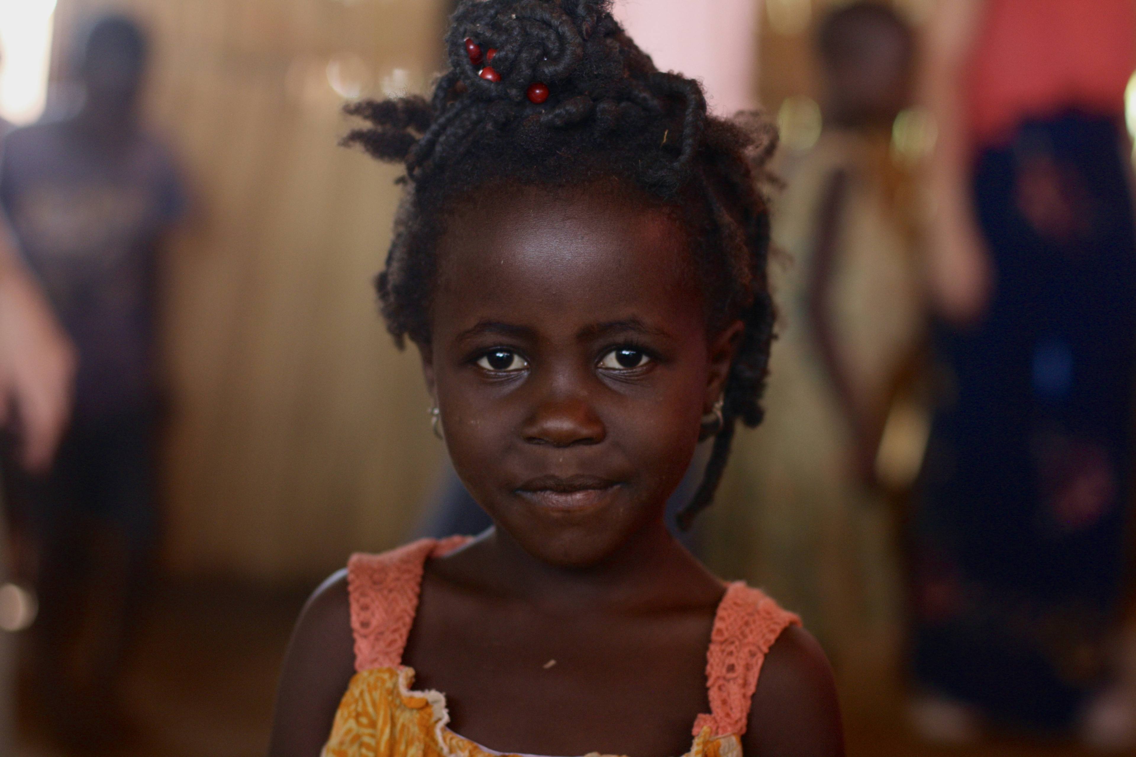 Young girl with beaded cornrows