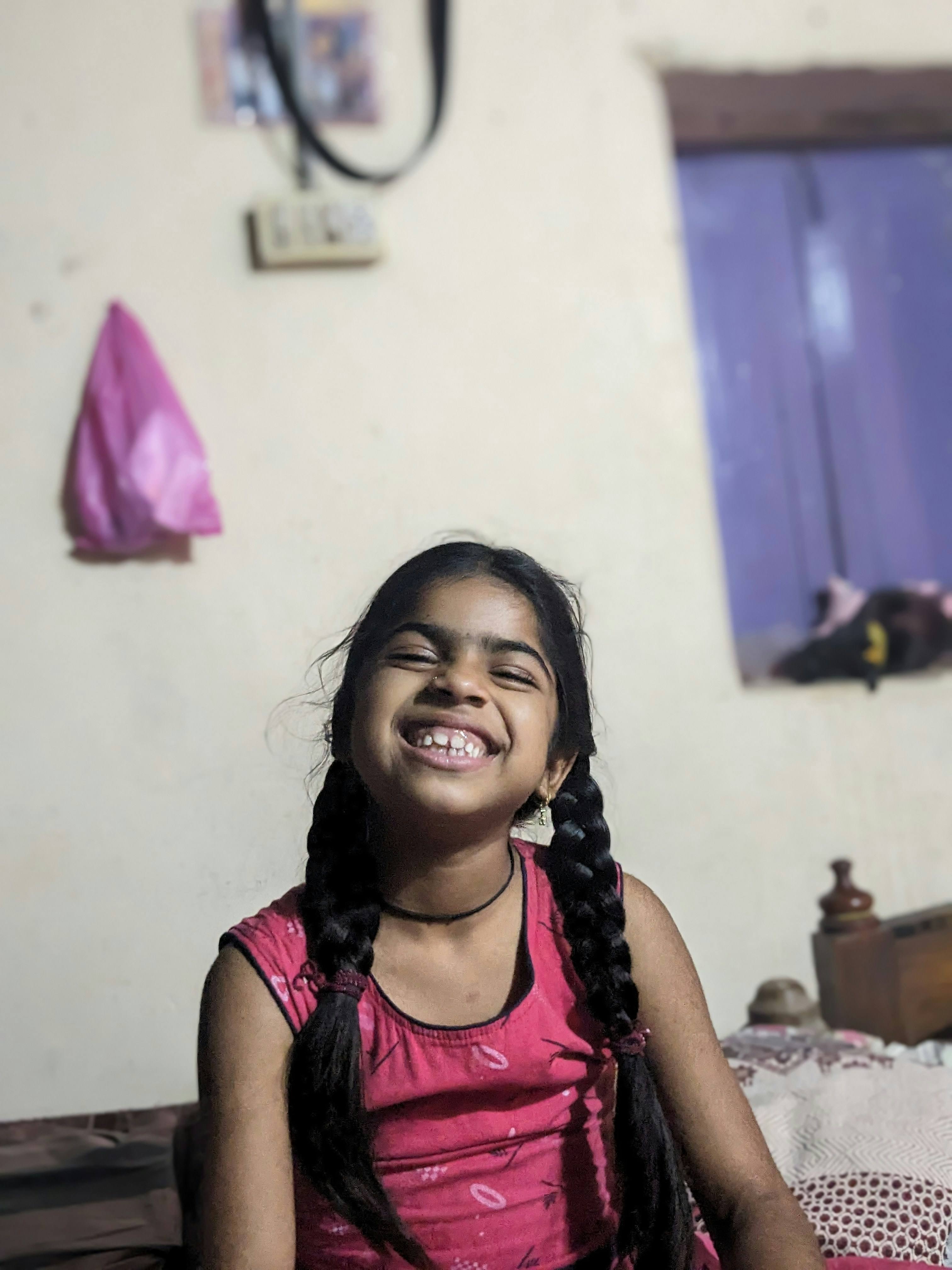 Child with high ponytail braids